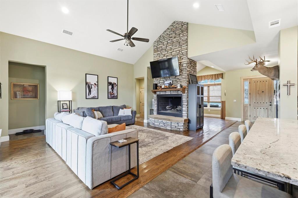 3300 Rigsby Lane Celina, TX 75009 - Photo 10 of 40 a living room with furniture and a fireplace