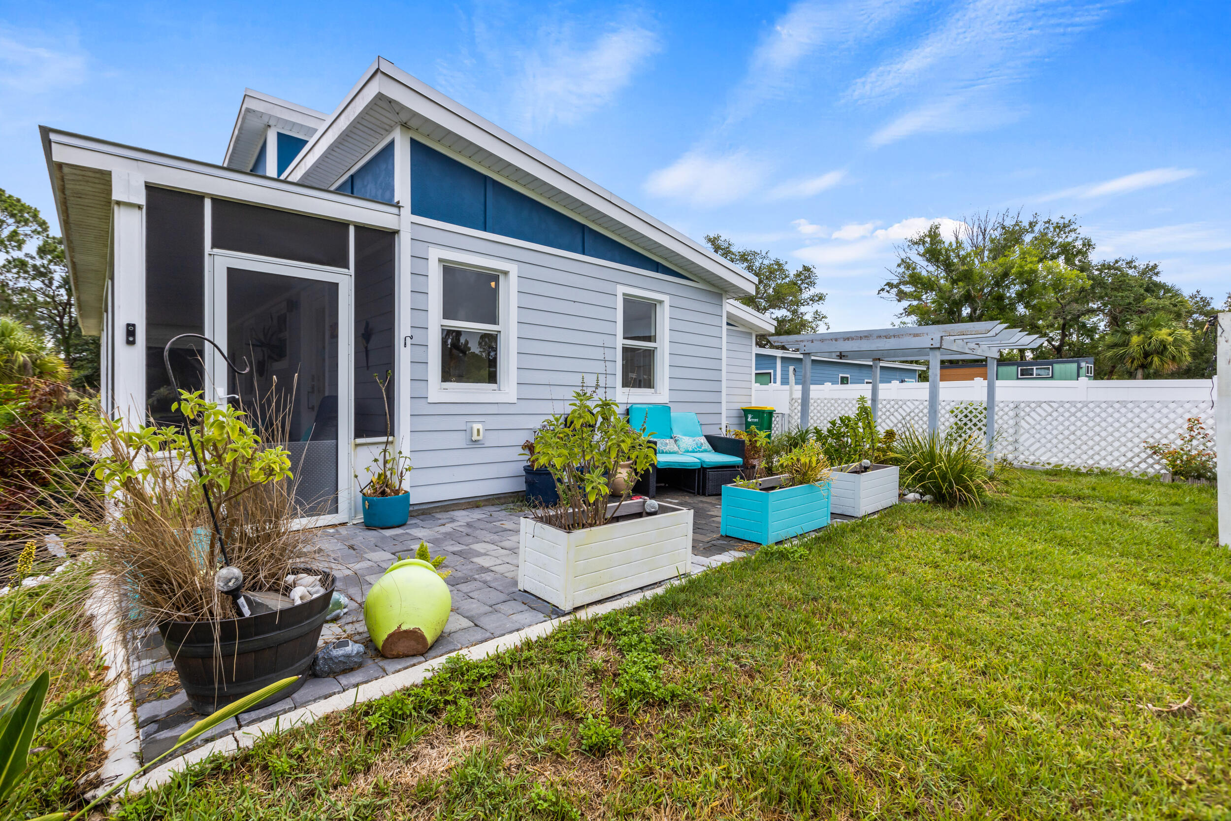 204 Flamingo Road Cocoa, FL 32926 - Photo 13 of 18 a view of a house with backyard and sitting area