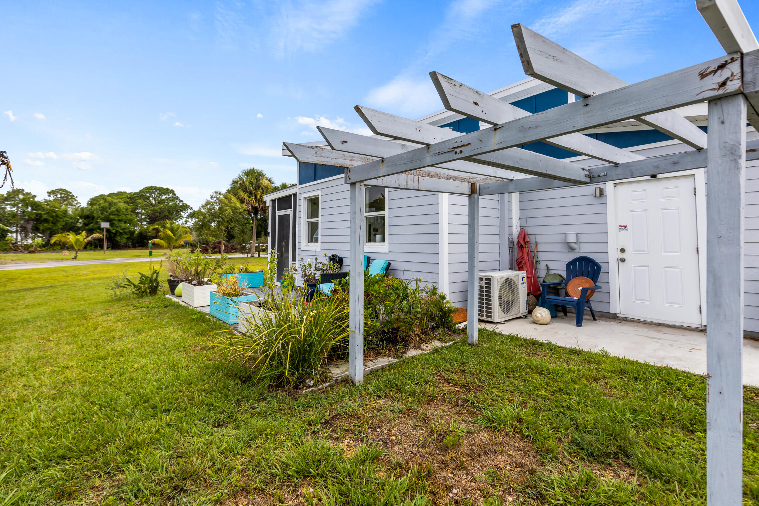 204 Flamingo Road Cocoa, FL 32926 - Photo 14 of 18 a view of a porch and garden