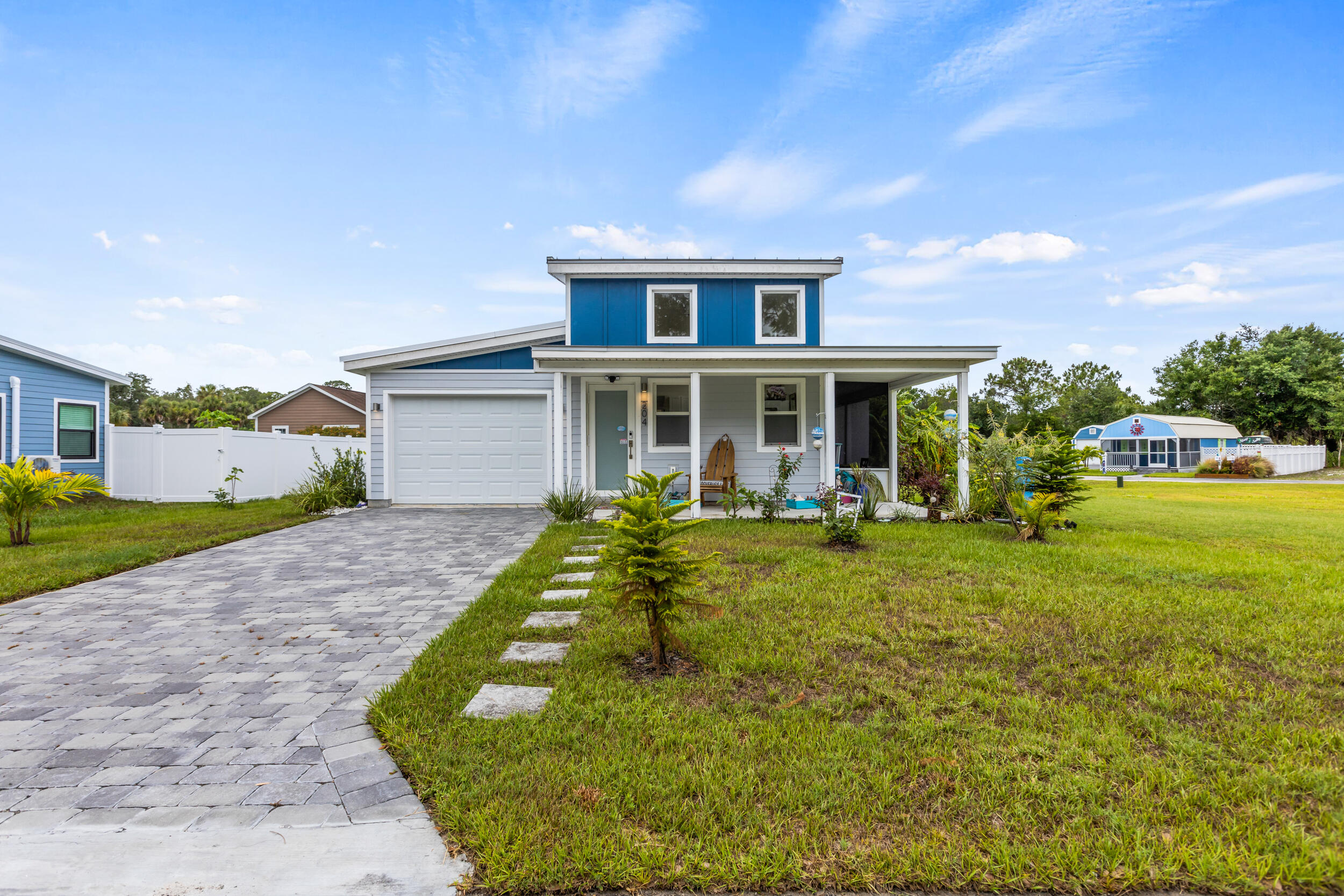 204 Flamingo Road Cocoa, FL 32926 - Photo 2 of 18 a front view of a house with a yard