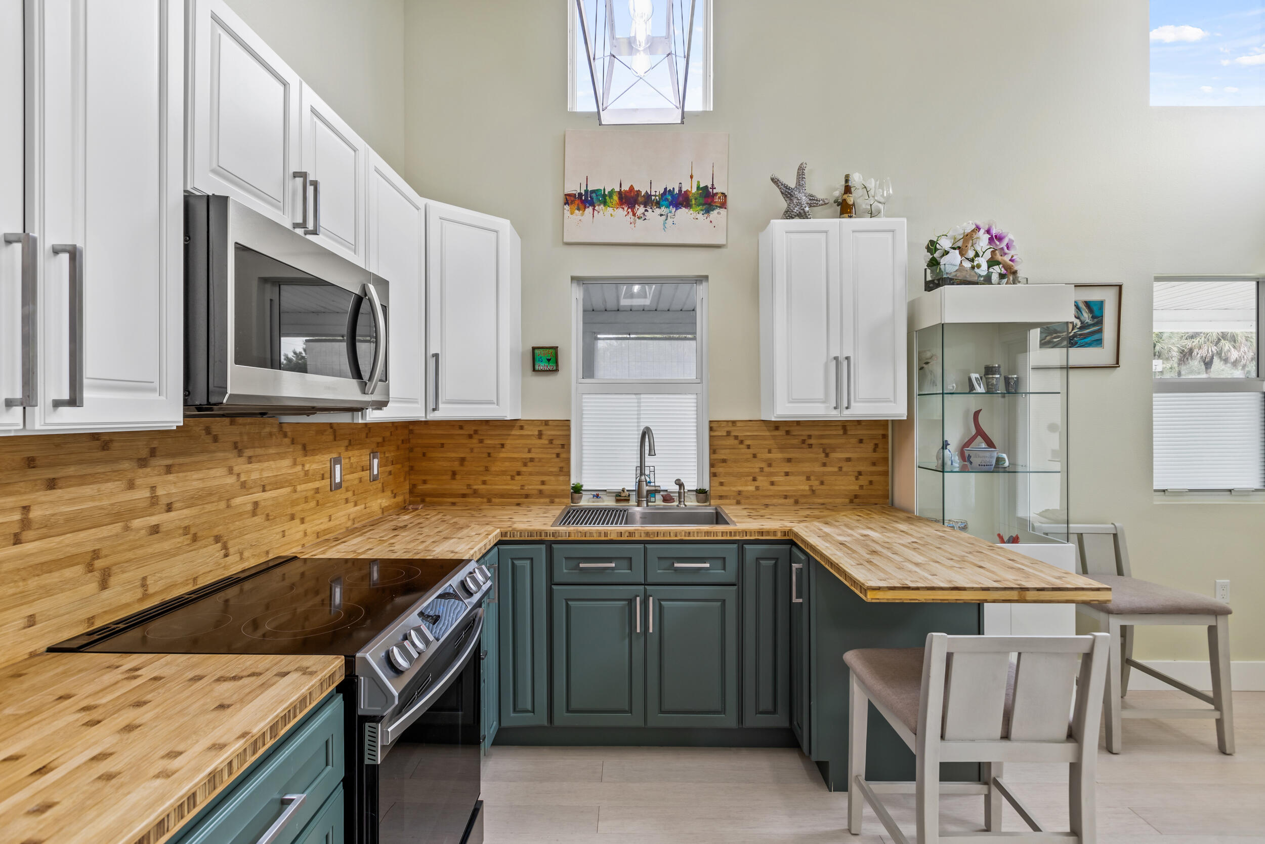 204 Flamingo Road Cocoa, FL 32926 - Photo 5 of 18 a kitchen with stainless steel appliances granite countertop a sink stove and cabinets
