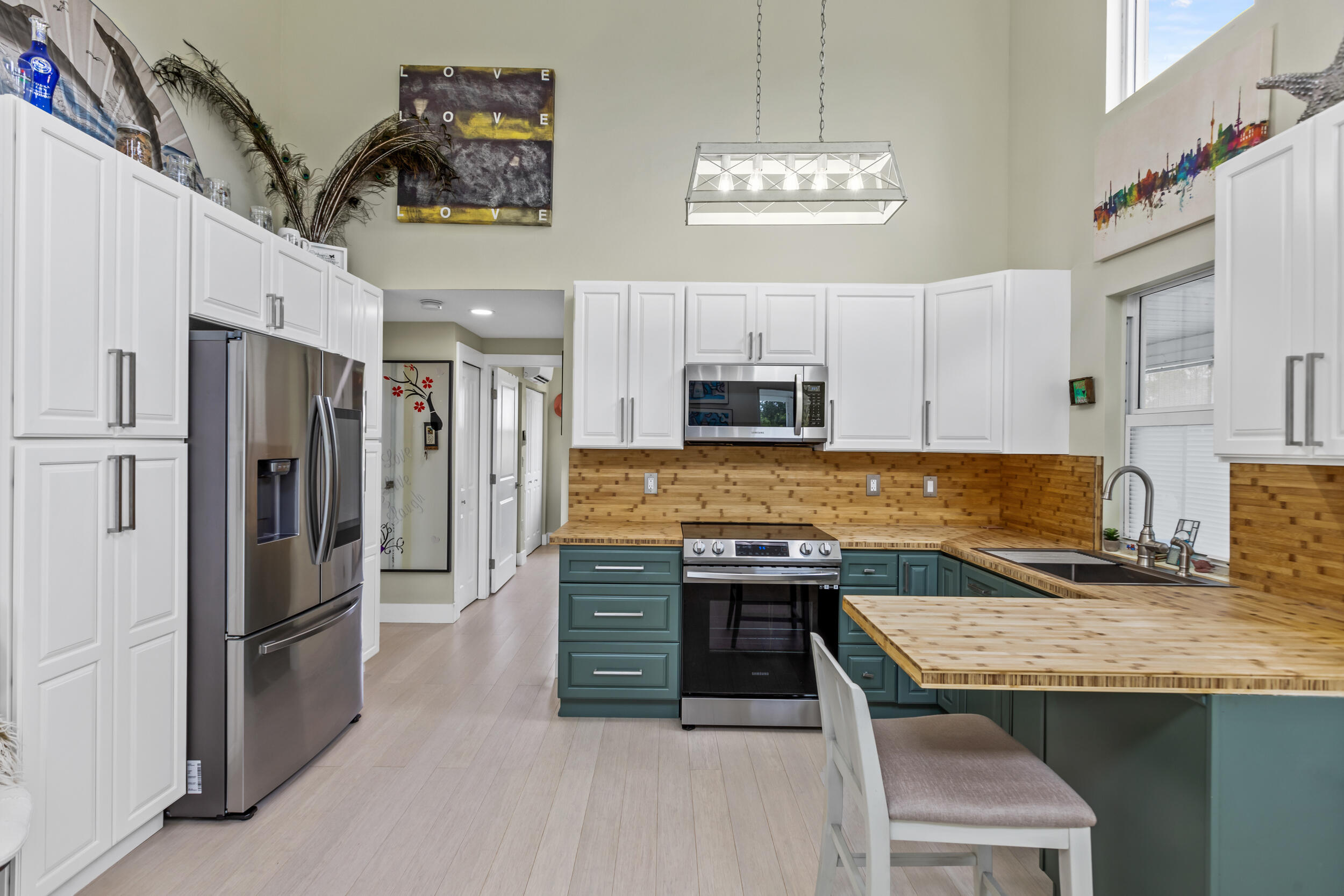 204 Flamingo Road Cocoa, FL 32926 - Photo 6 of 18 a kitchen with stainless steel appliances granite countertop a sink stove and refrigerator