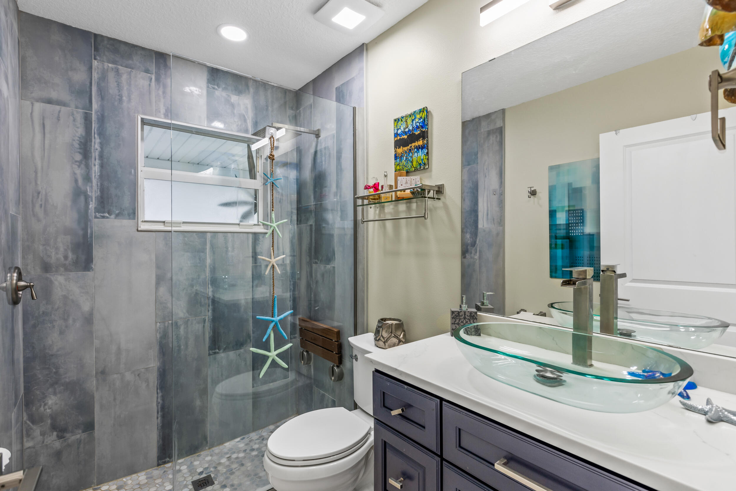 204 Flamingo Road Cocoa, FL 32926 - Photo 8 of 18 a bathroom with a sink a toilet and shower