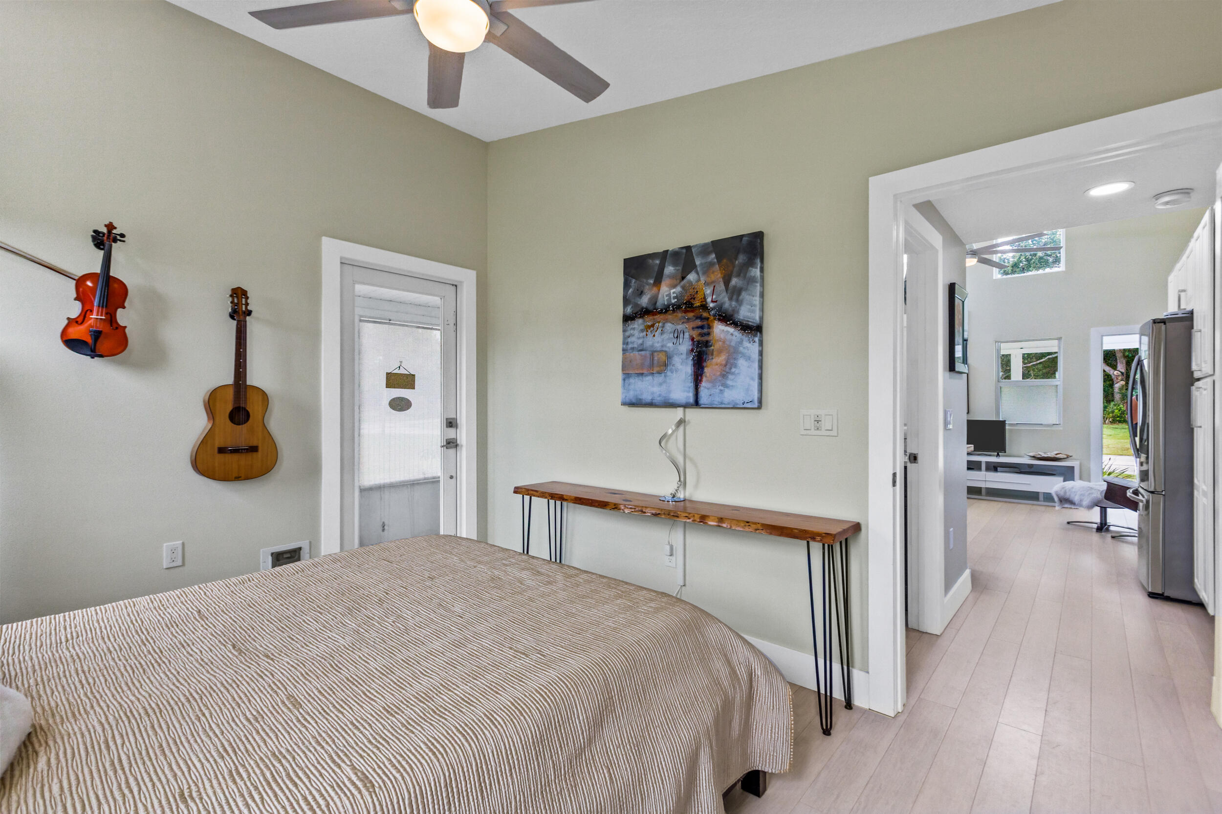 204 Flamingo Road Cocoa, FL 32926 - Photo 10 of 18 a bedroom with a bed and a chandelier