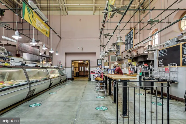 a view of a cars park in front of a building