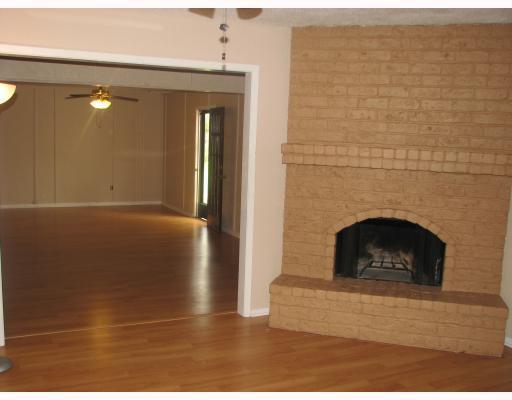 209 Oak Ridge Drive Corpus Christi, TX 78418 - Photo 2 of 5 a view of a livingroom with a fireplace and window