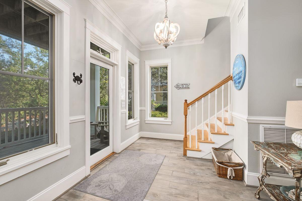 40 Chelsea Loop Road Santa Rosa Beach, FL 32459 - Photo 15 of 46 a room with wooden floor and windows