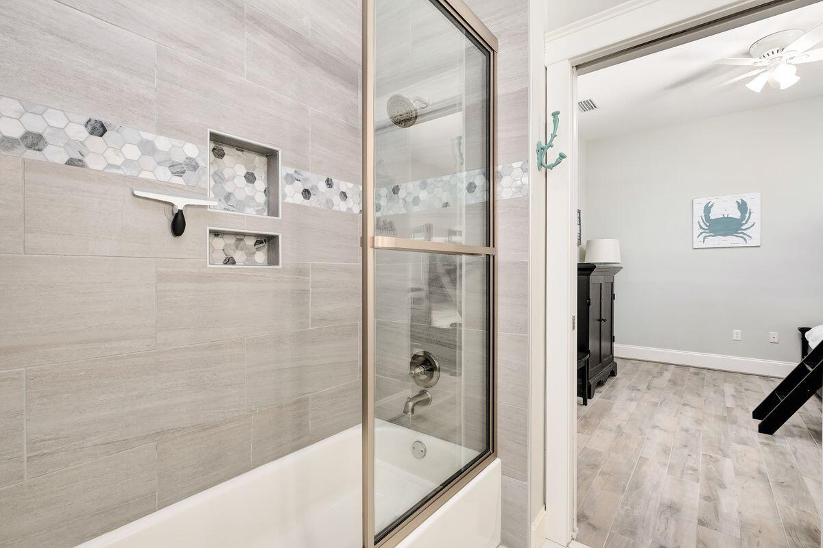 40 Chelsea Loop Road Santa Rosa Beach, FL 32459 - Photo 18 of 46 a bathroom with a bathtub and a shower