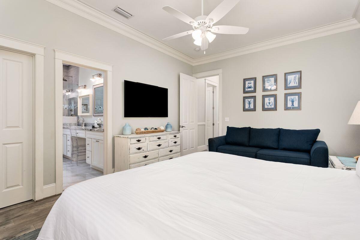 40 Chelsea Loop Road Santa Rosa Beach, FL 32459 - Photo 20 of 46 a bedroom with a bed and a flat screen tv