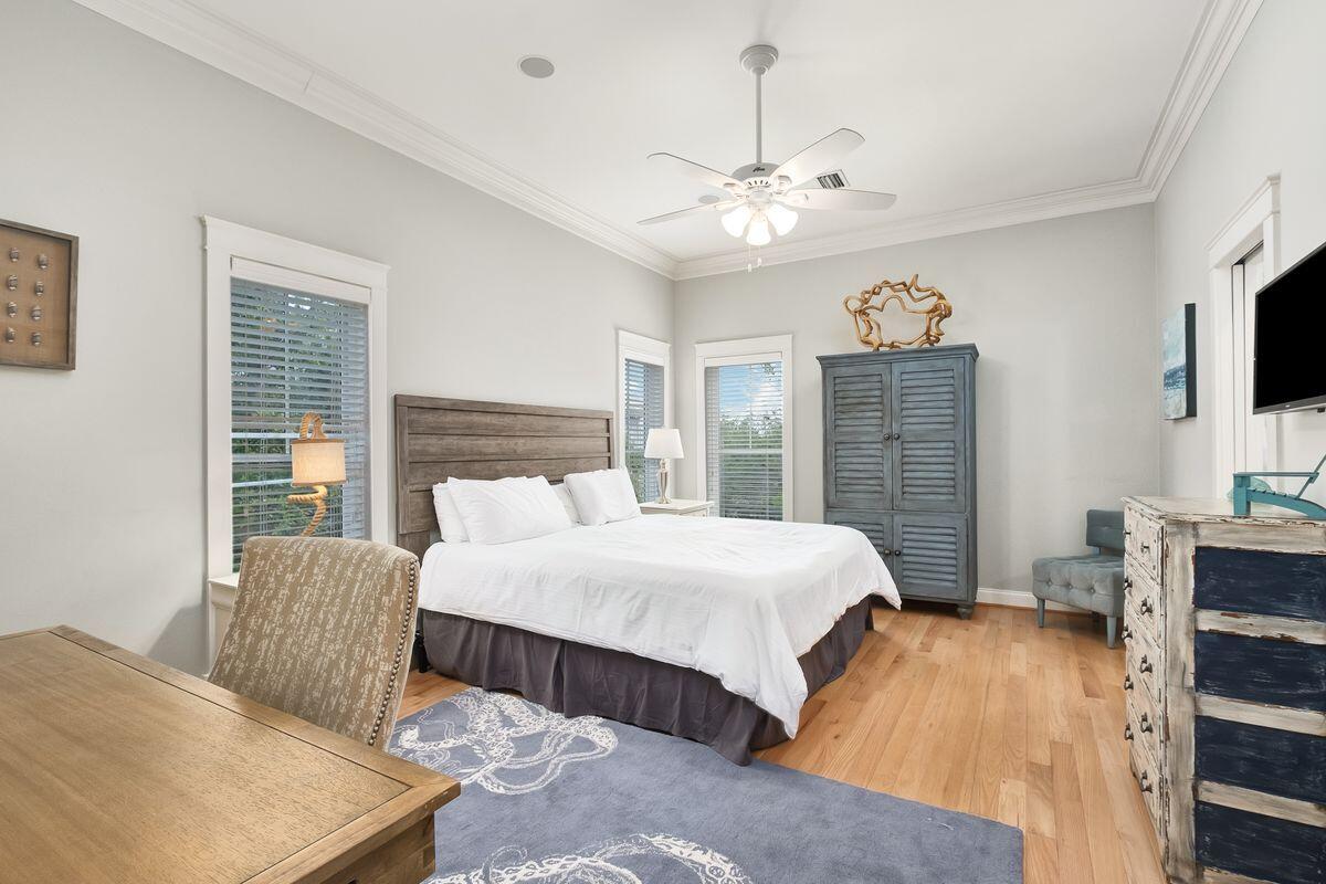 40 Chelsea Loop Road Santa Rosa Beach, FL 32459 - Photo 25 of 46 a bedroom with a large bed and a flat screen tv