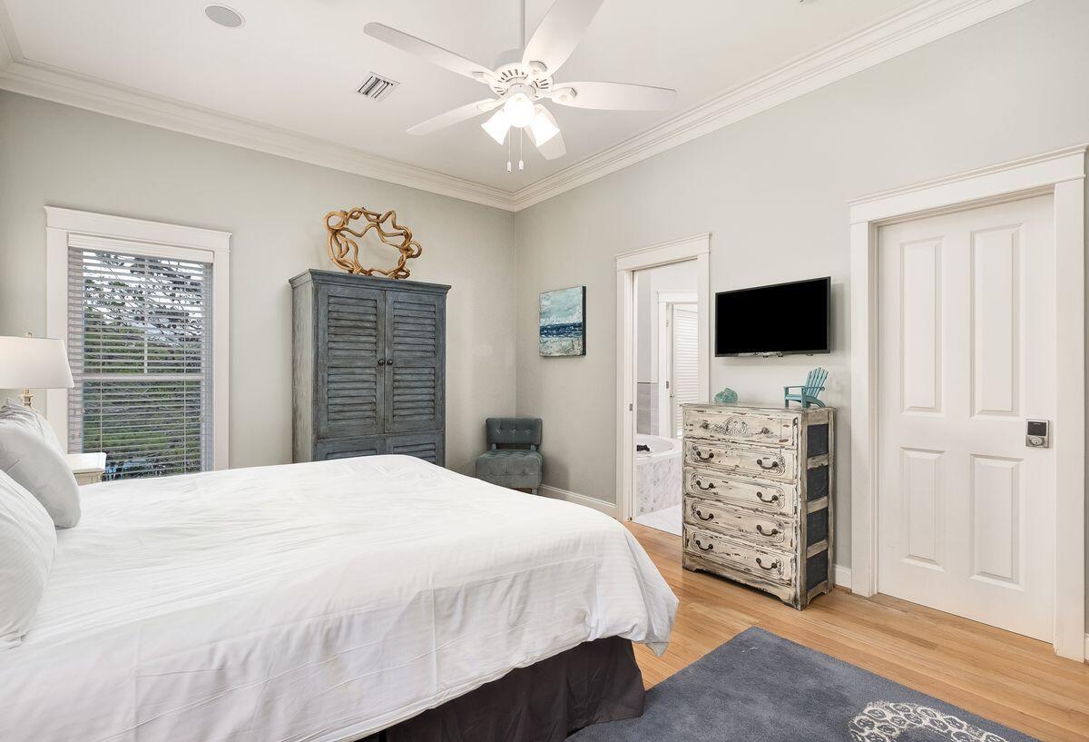 40 Chelsea Loop Road Santa Rosa Beach, FL 32459 - Photo 26 of 46 a bedroom with a large bed and a flat tv screen