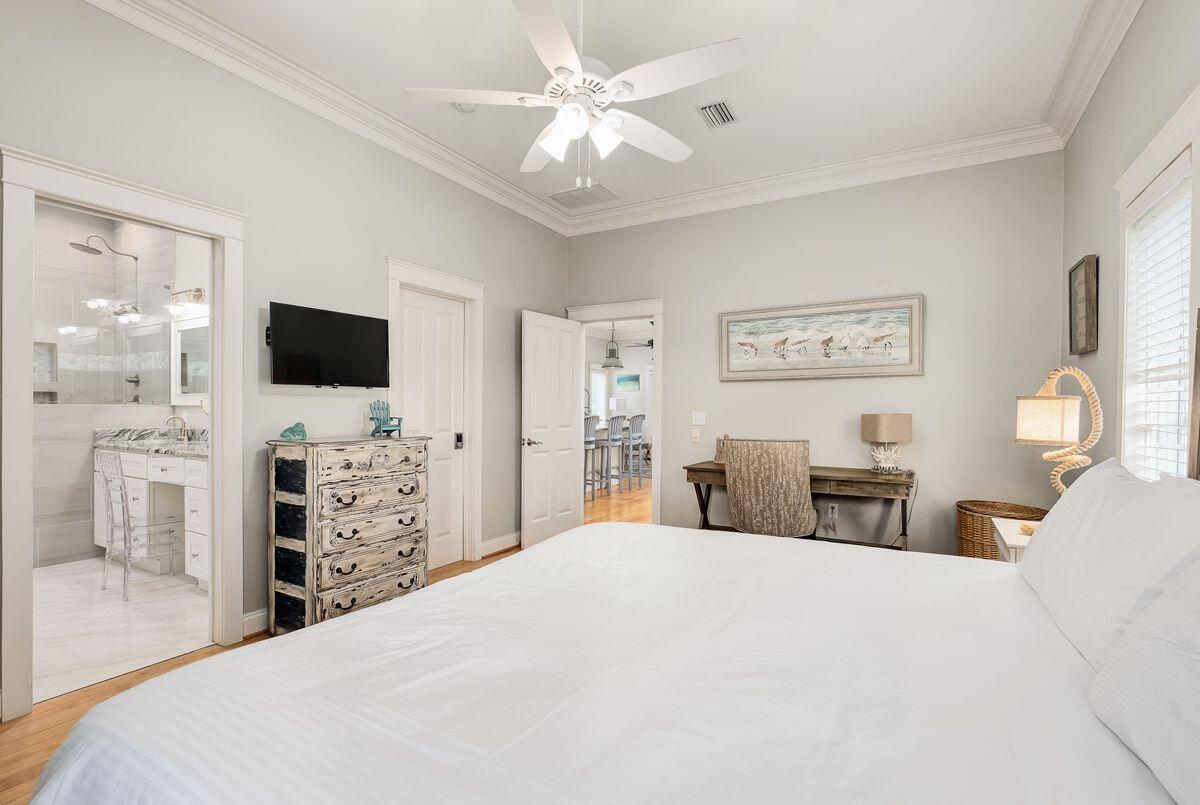 40 Chelsea Loop Road Santa Rosa Beach, FL 32459 - Photo 27 of 46 a bedroom with a large bed and a flat tv screen on dresser