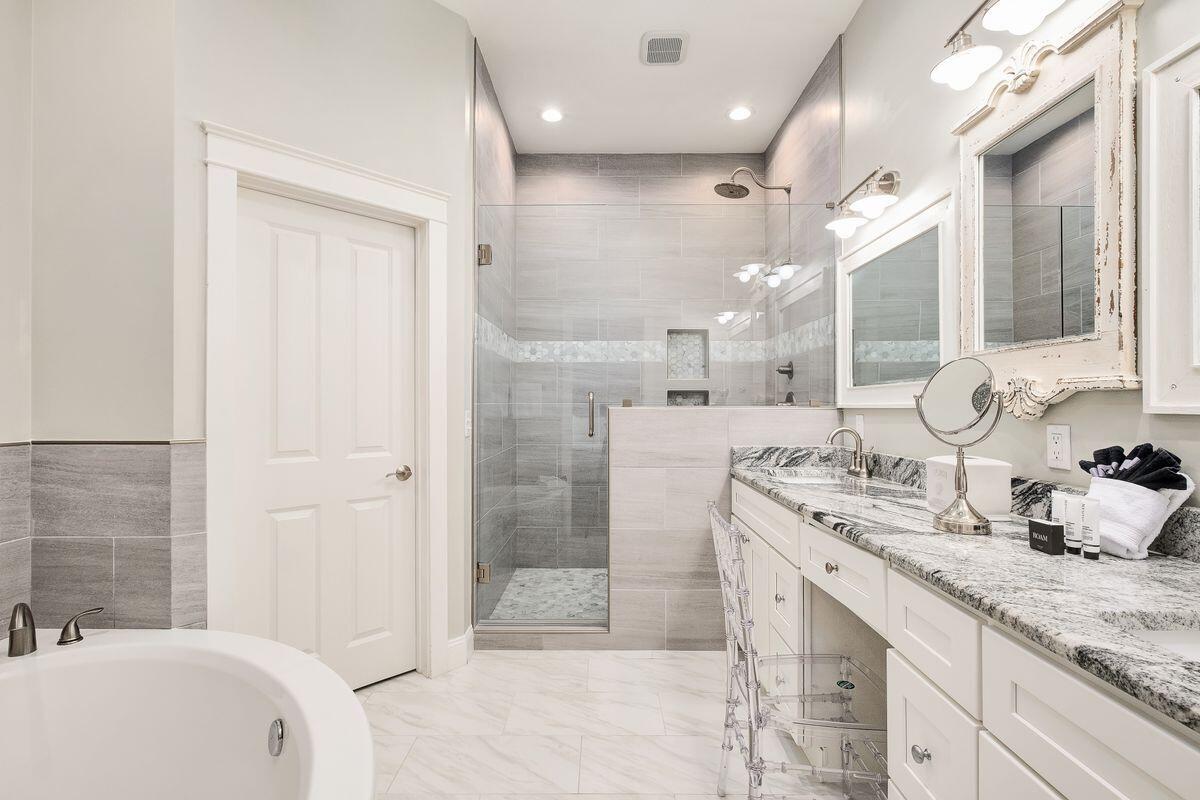 40 Chelsea Loop Road Santa Rosa Beach, FL 32459 - Photo 28 of 46 a bathroom with a granite countertop sink mirror and a bath tub