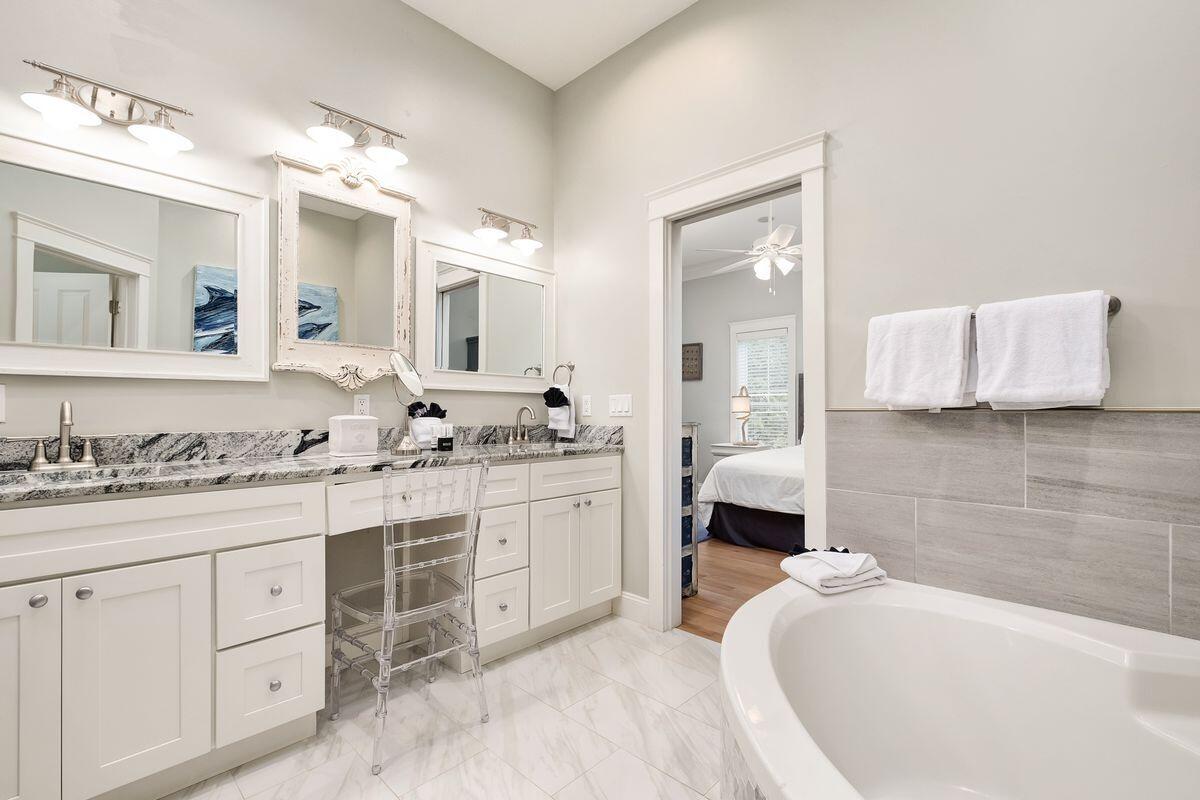 40 Chelsea Loop Road Santa Rosa Beach, FL 32459 - Photo 29 of 46 a bathroom with a granite countertop sink mirror and bathtub