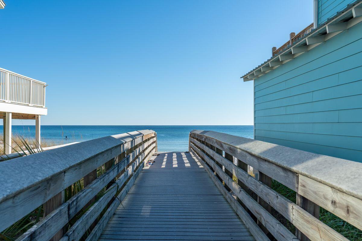 40 Chelsea Loop Road Santa Rosa Beach, FL 32459 - Photo 45 of 46 a balcony with a table and chairs