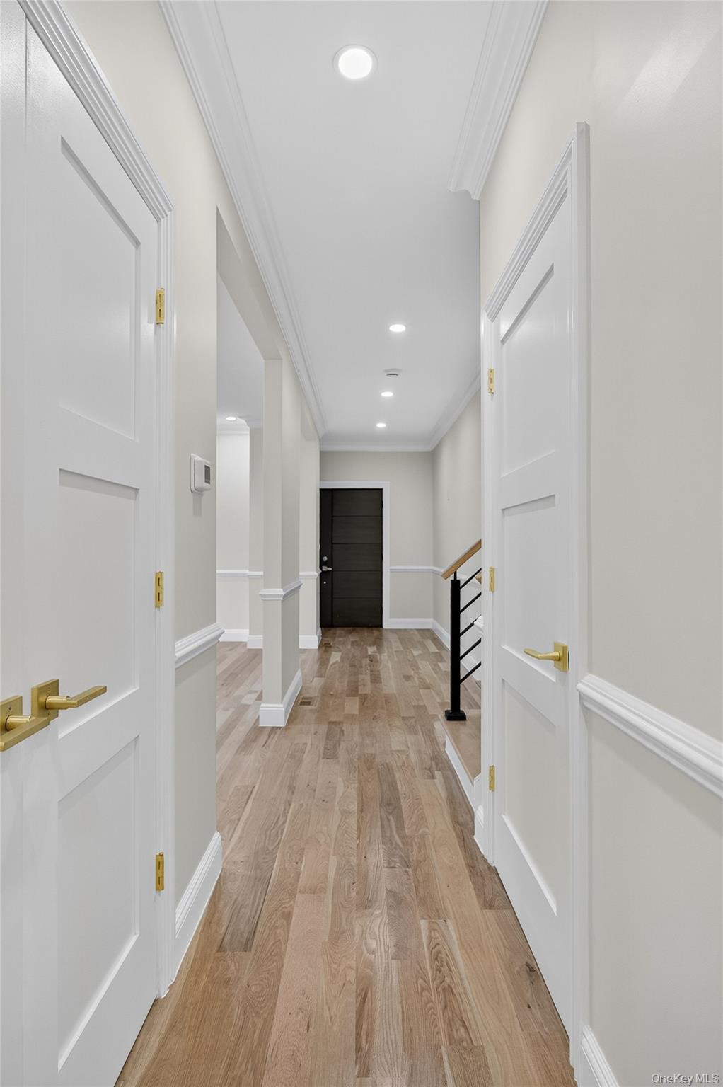 80 Clapham Avenue Manhasset, NY 11030 - Photo 16 of 31 Hall featuring ornamental molding, light wood-style floors, recessed lighting, and stairway