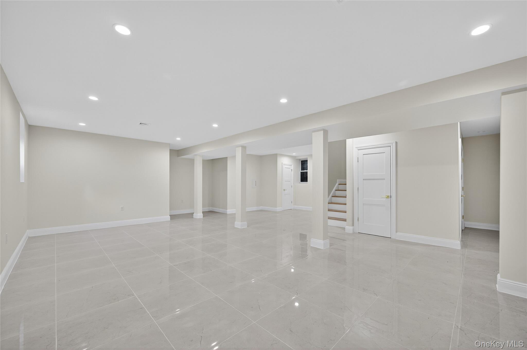 80 Clapham Avenue Manhasset, NY 11030 - Photo 26 of 31 Finished basement featuring recessed lighting and stairway