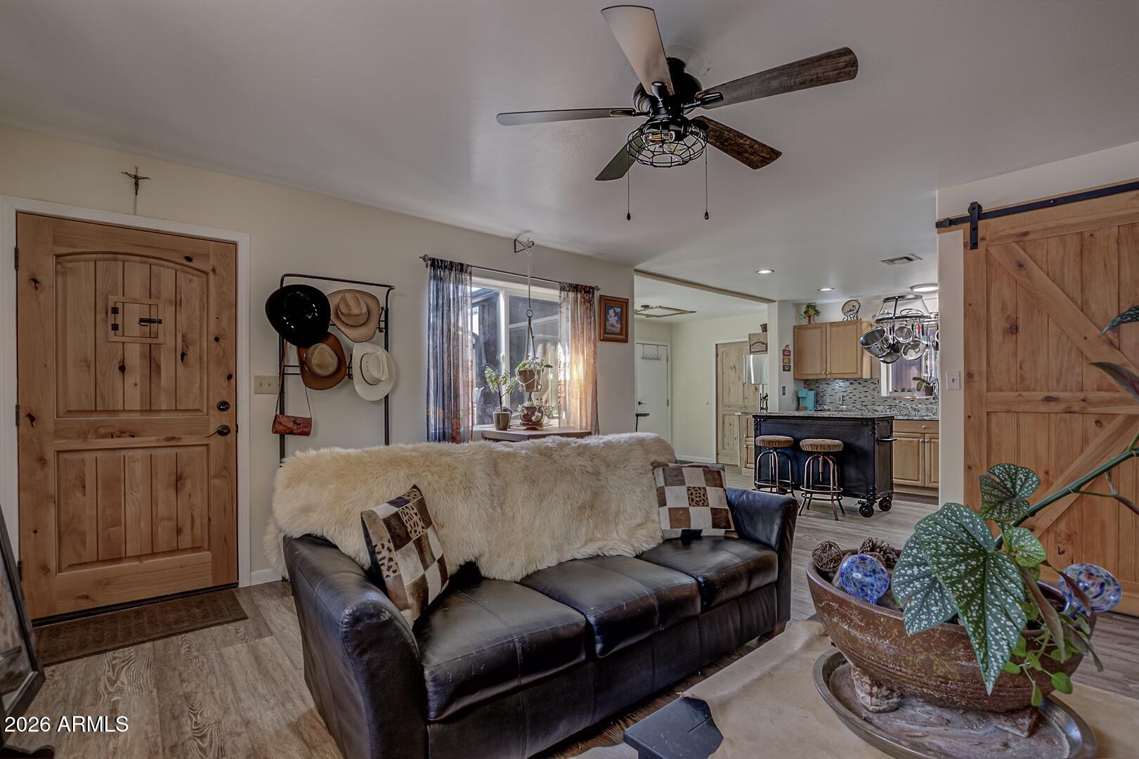 3762 Watertank Road Pine, AZ 85544 - Photo 4 of 38 a living room with furniture and a fireplace