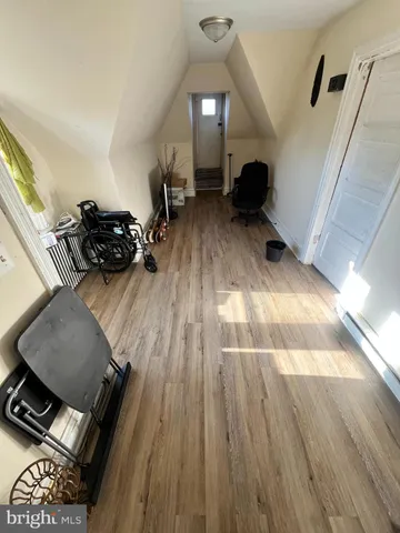 a view of a living room and wooden floor