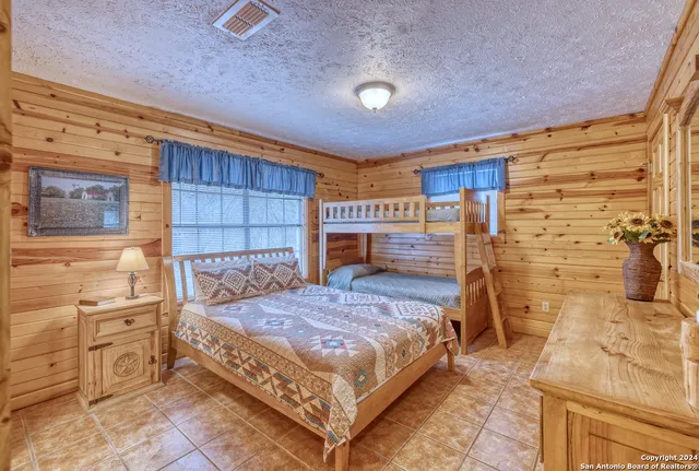 a bedroom with a bed and a table