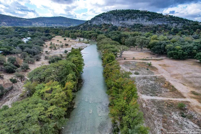 a view of a lake with mountains in the background