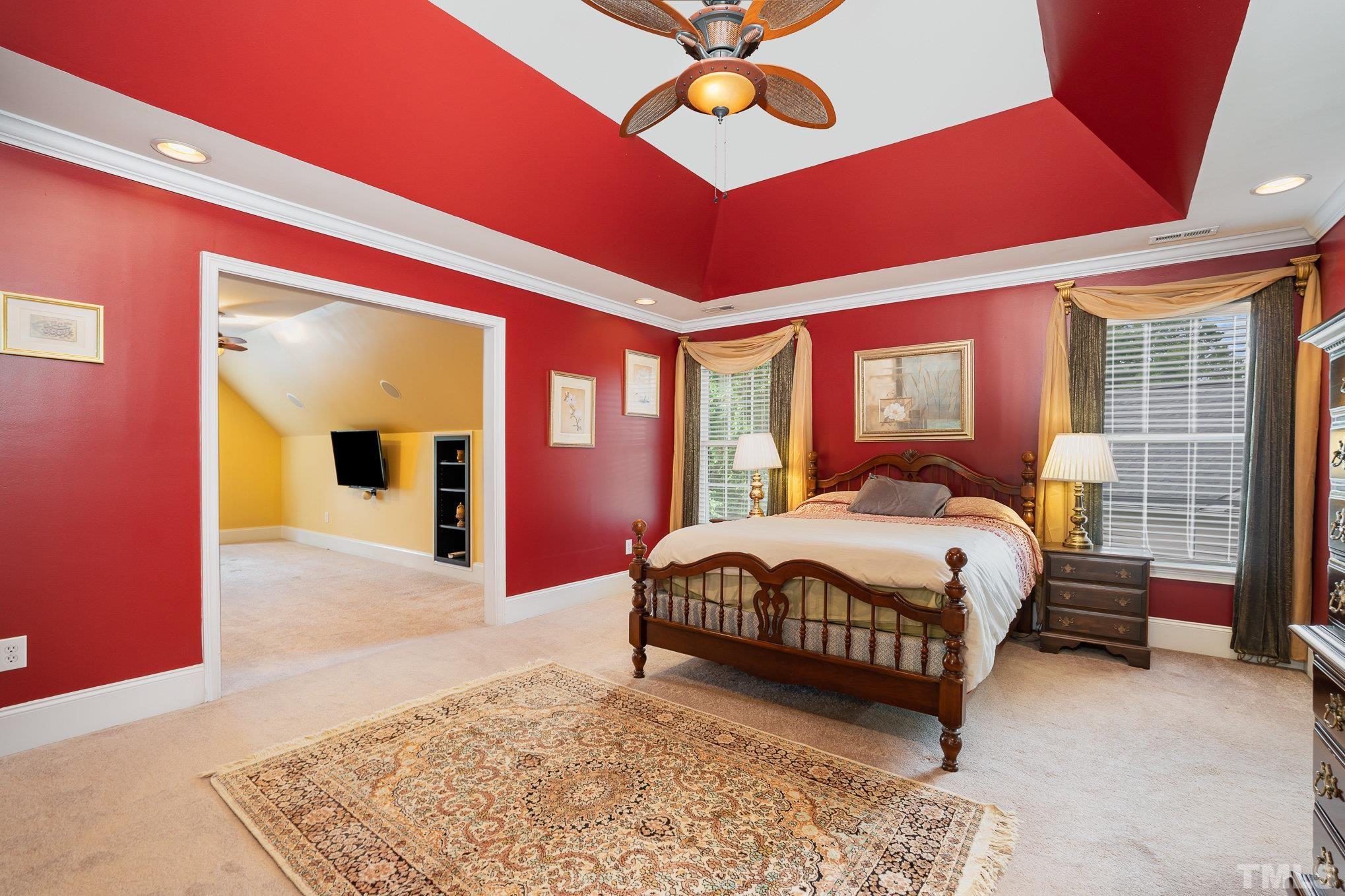 9300 Palm Bay Circle Raleigh, NC 27617 - Photo 11 of 30 a bedroom with a bed lamp and a large window