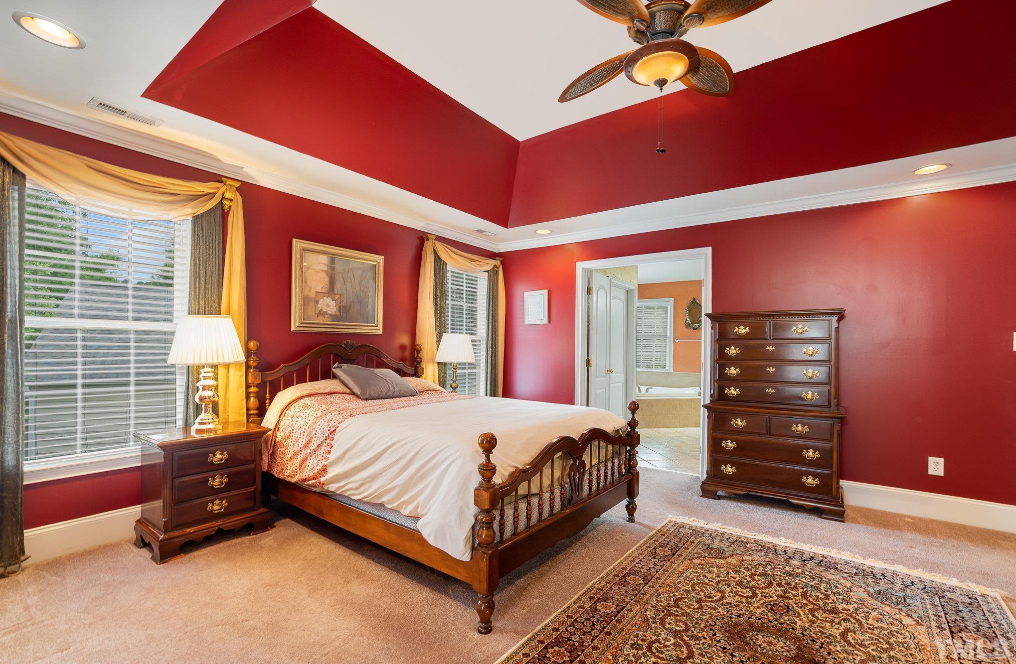 9300 Palm Bay Circle Raleigh, NC 27617 - Photo 12 of 30 a bedroom with a bed and dresser