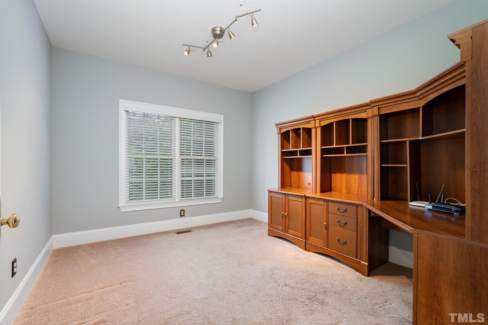 9300 Palm Bay Circle Raleigh, NC 27617 - Photo 16 of 30 a view of an empty room with window and furniture