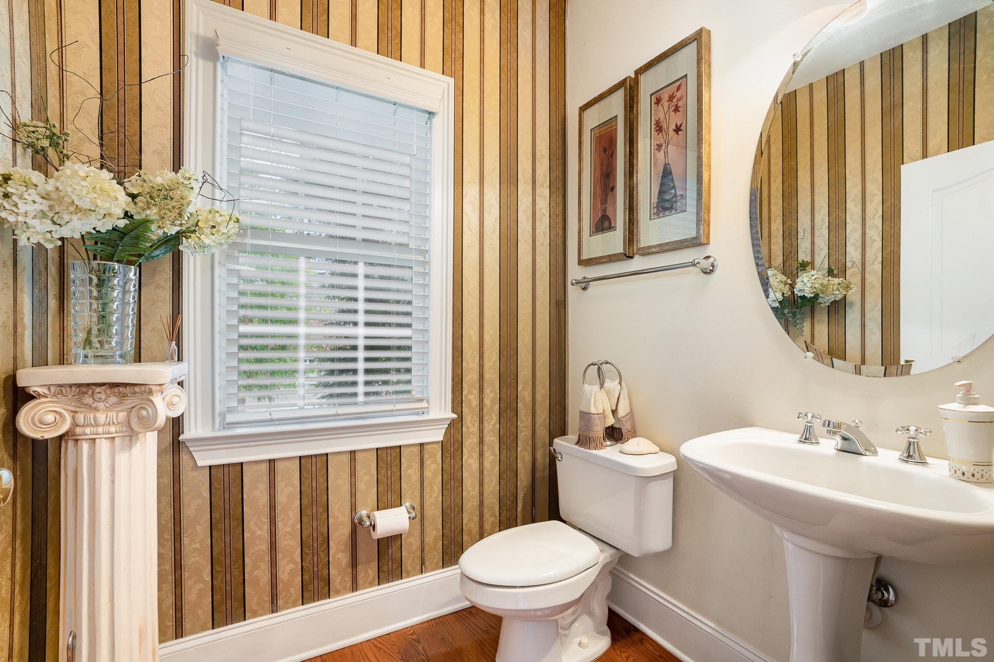9300 Palm Bay Circle Raleigh, NC 27617 - Photo 17 of 30 a bathroom with a sink a toilet and a mirror