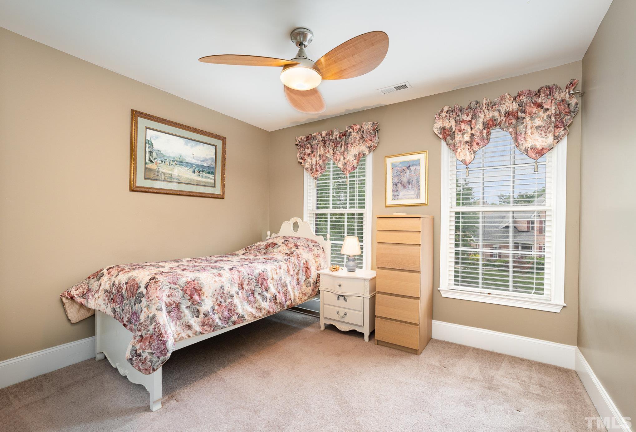 9300 Palm Bay Circle Raleigh, NC 27617 - Photo 20 of 30 a bed room with a bed and a window