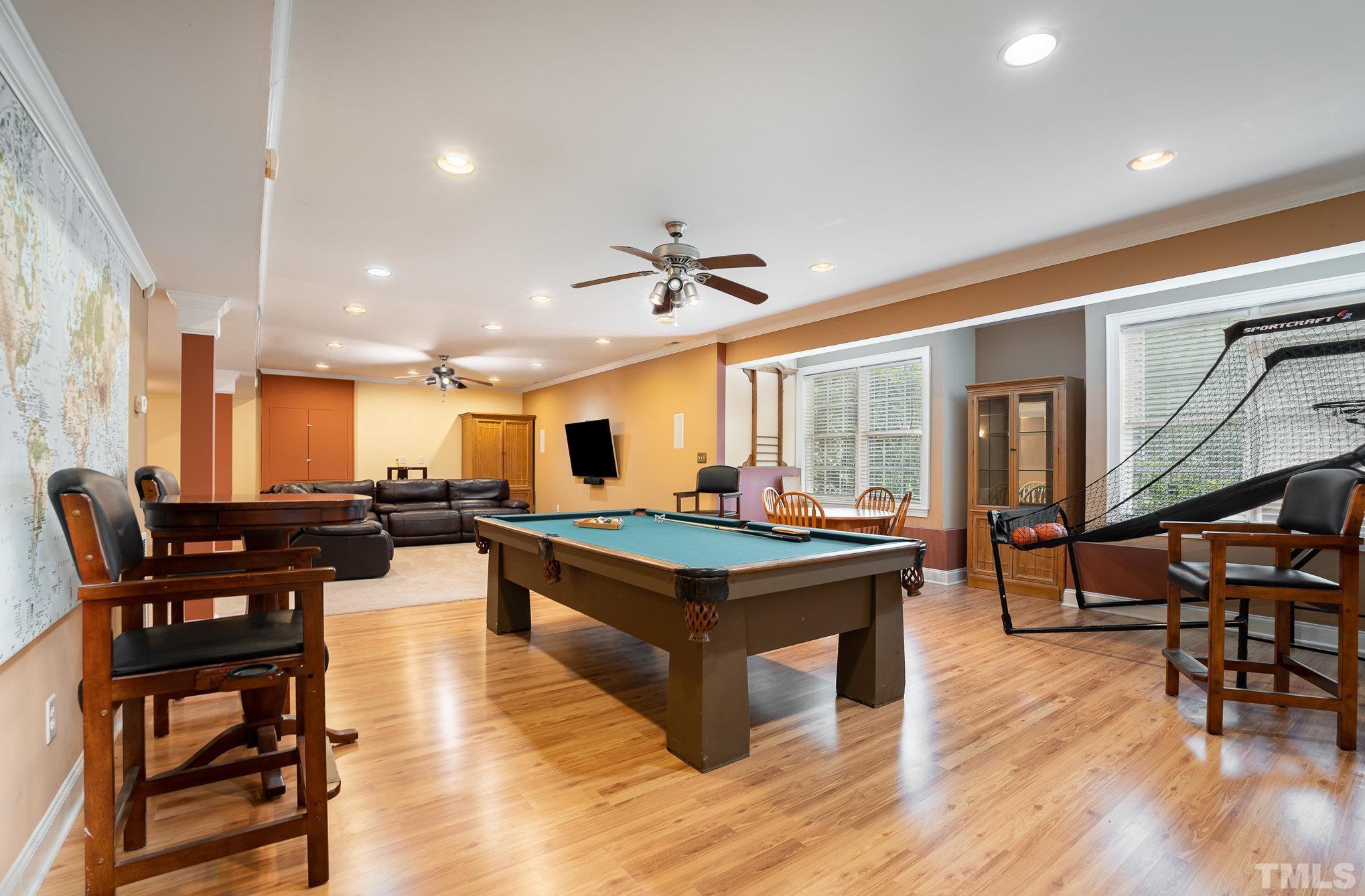 9300 Palm Bay Circle Raleigh, NC 27617 - Photo 22 of 30 a living room with furniture a wooden floor and a chandelier
