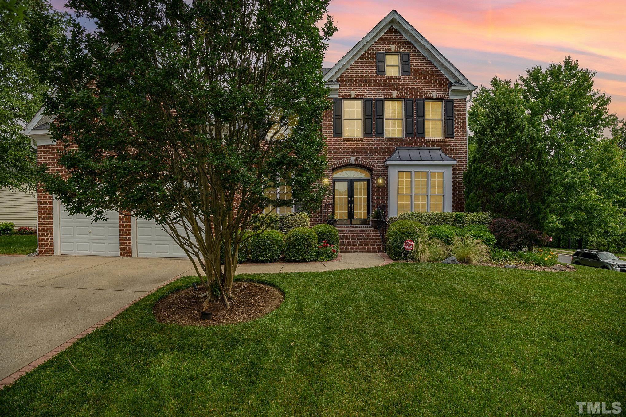 9300 Palm Bay Circle Raleigh, NC 27617 - Photo 27 of 30 a front view of a house with a yard