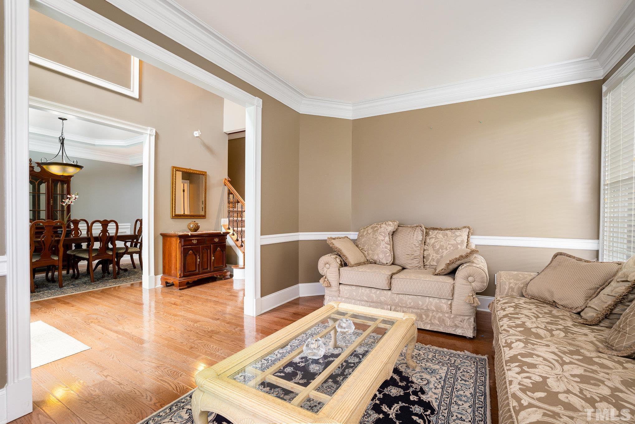 9300 Palm Bay Circle Raleigh, NC 27617 - Photo 5 of 30 a living room with furniture and a rug