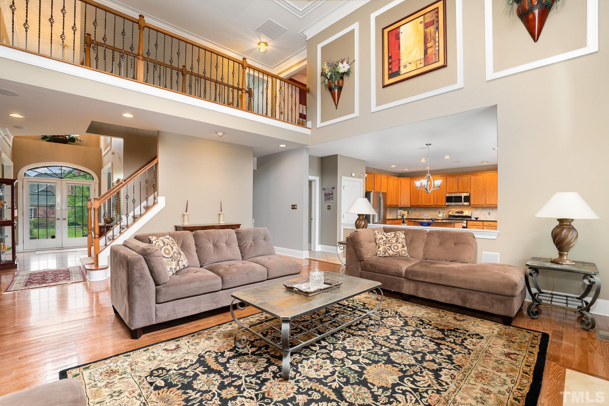 9300 Palm Bay Circle Raleigh, NC 27617 - Photo 7 of 30 a living room with furniture and a rug