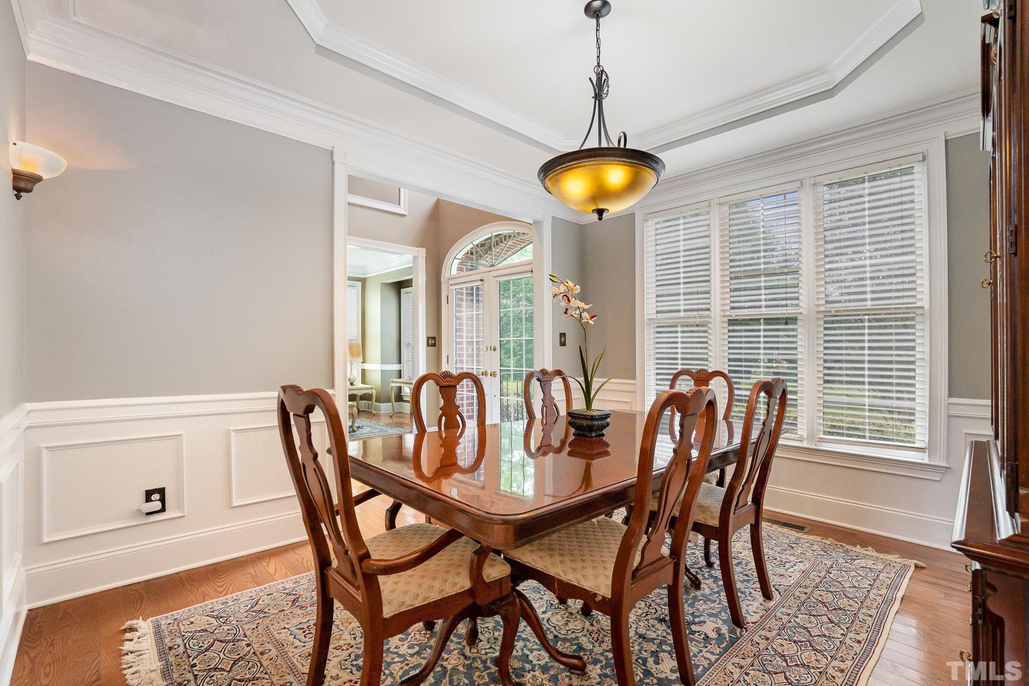 9300 Palm Bay Circle Raleigh, NC 27617 - Photo 8 of 30 a view of a dining room with furniture and chandelier