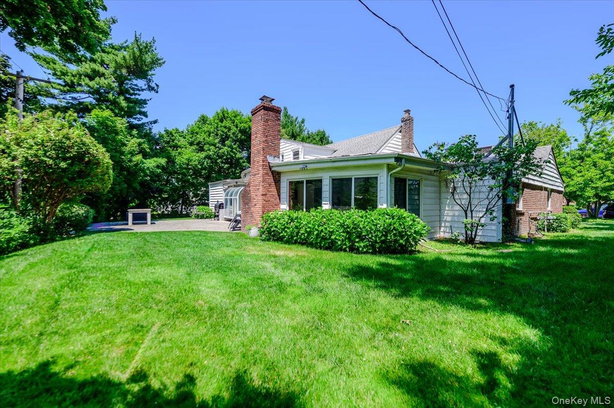 70 Longfellow Road Great Neck, NY 11023 - Photo 27 of 28 a front view of house with a garden