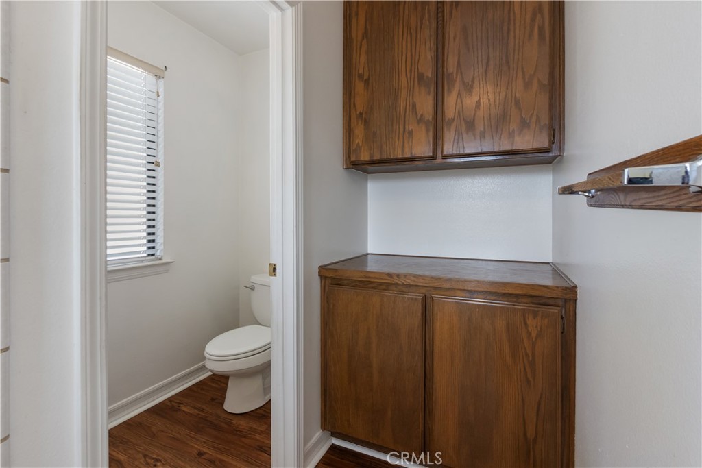 17656 Mockingbird Hill Circle Riverside, CA 92504 - Photo 22 of 49 a bathroom with a toilet and a microwave