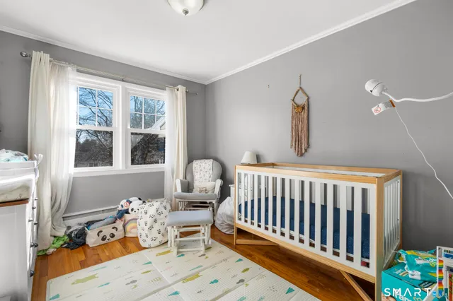 a bedroom with furniture and a book shelf
