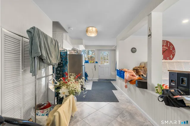 a living room with furniture and stairs