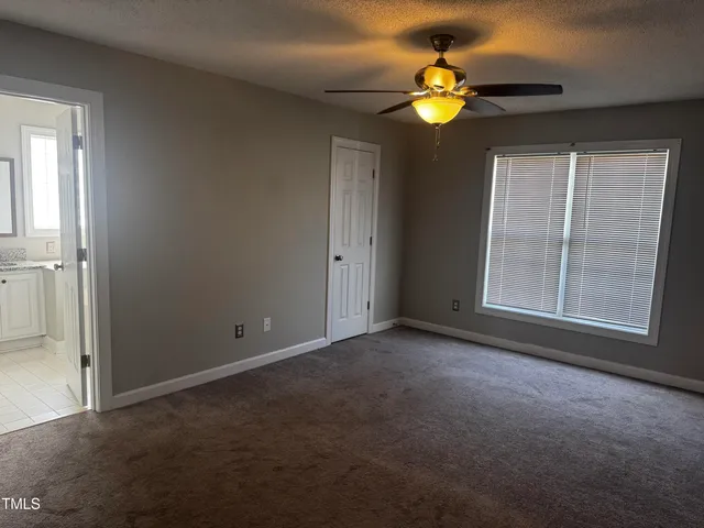 a view of empty room with a window