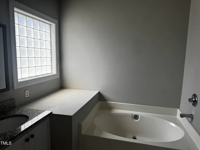 a bathroom with a bathtub