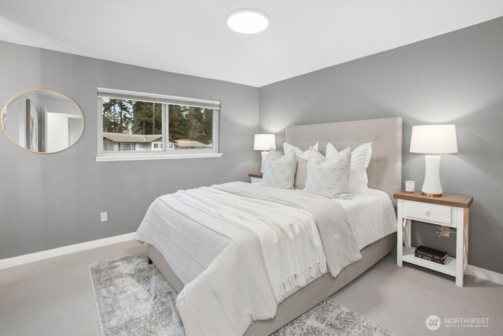 1104 204th Place Southeast Bothell, WA 98012 - Photo 13 of 30 a bedroom with a bed and a window