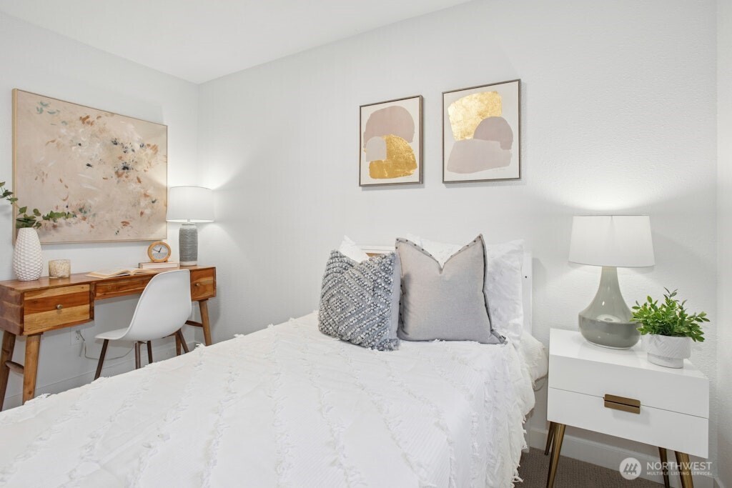 1104 204th Place Southeast Bothell, WA 98012 - Photo 18 of 30 a bedroom with a bed and a potted plant