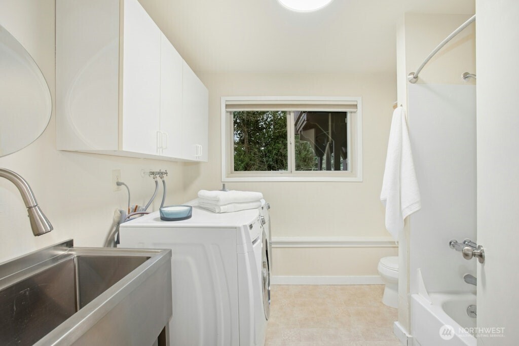 1104 204th Place Southeast Bothell, WA 98012 - Photo 24 of 30 a bathroom with a granite countertop sink and a bathtub