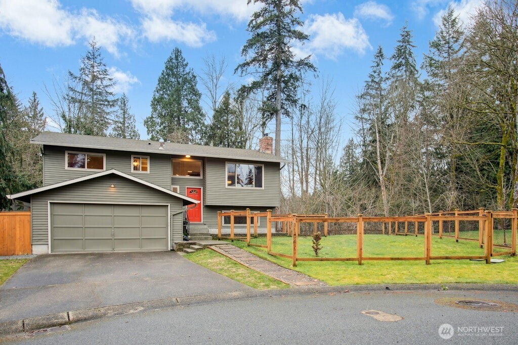 1104 204th Place Southeast Bothell, WA 98012 - Photo 28 of 30 a front view of a house with a yard and trees