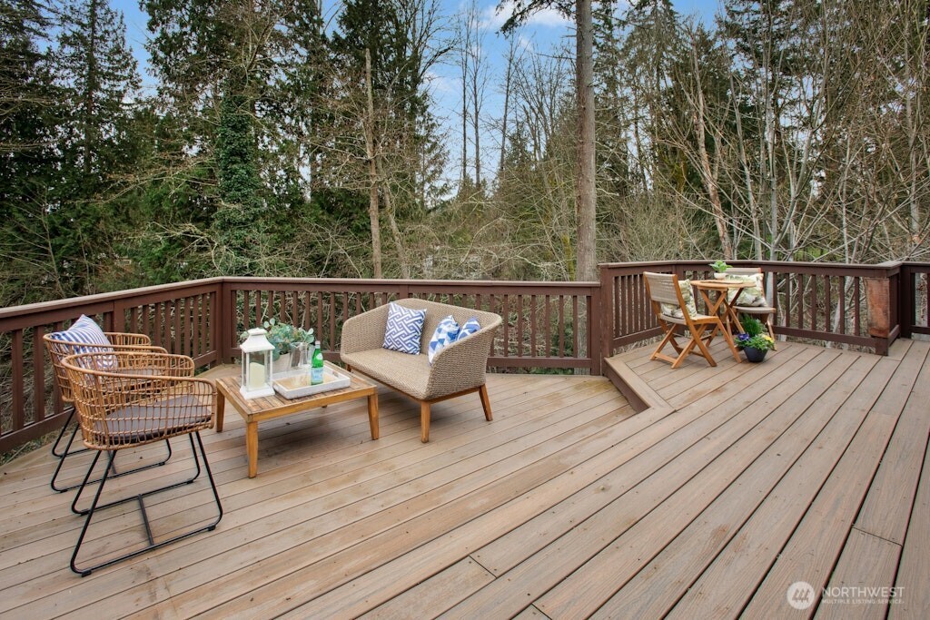 1104 204th Place Southeast Bothell, WA 98012 - Photo 10 of 30 a balcony with wooden floor table and chairs