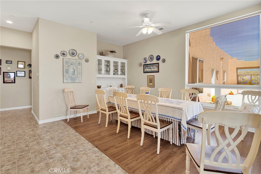 16222 Wild Road Helendale, CA 92342 - Photo 24 of 75 a dining room with wooden floor and stainless steel appliances