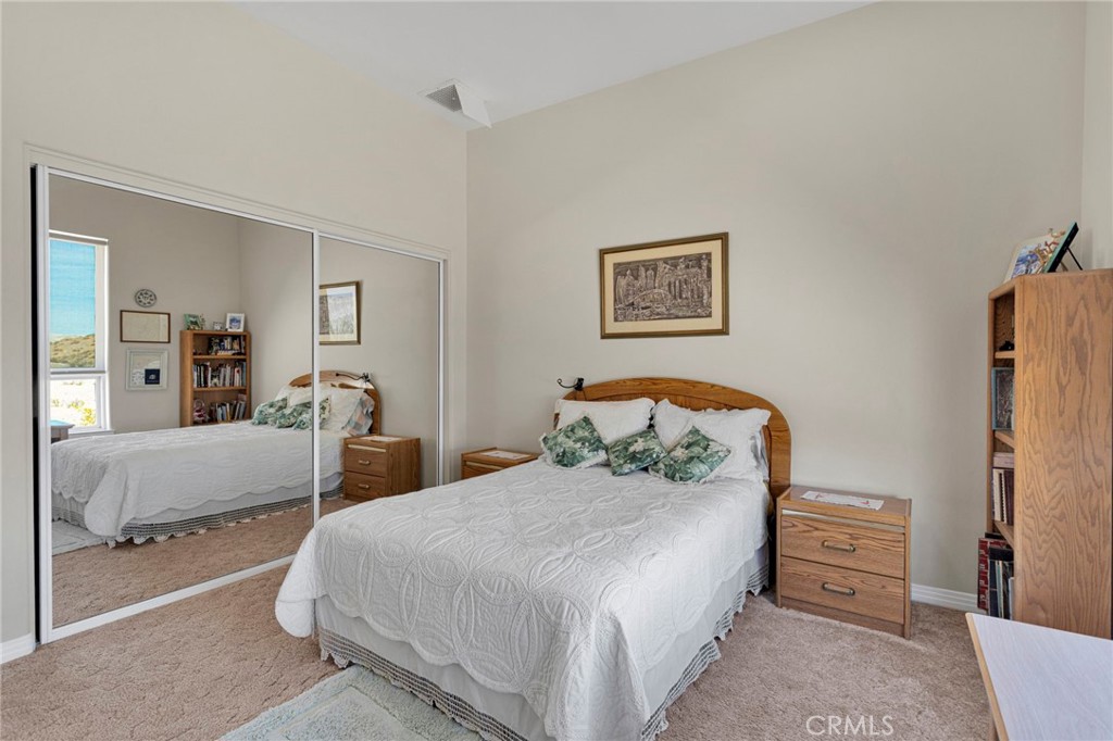 16222 Wild Road Helendale, CA 92342 - Photo 28 of 75 a bedroom with a bed and a couch