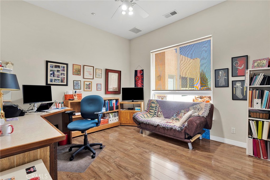 16222 Wild Road Helendale, CA 92342 - Photo 29 of 75 a living room with furniture and a flat screen tv