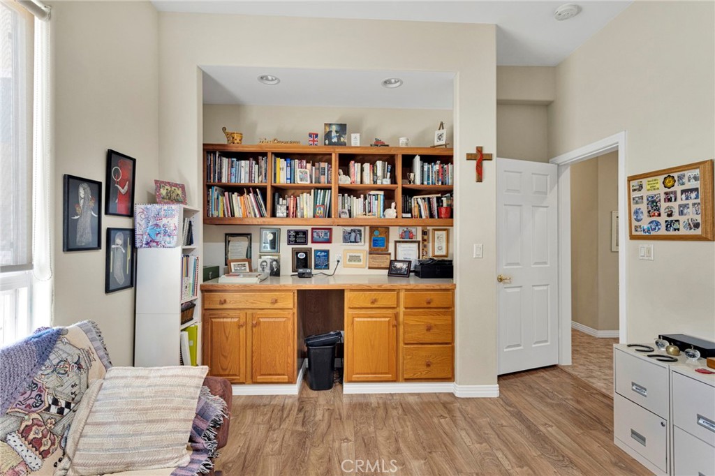 16222 Wild Road Helendale, CA 92342 - Photo 30 of 75 a living room with stainless steel appliances lots of furniture and wooden floors